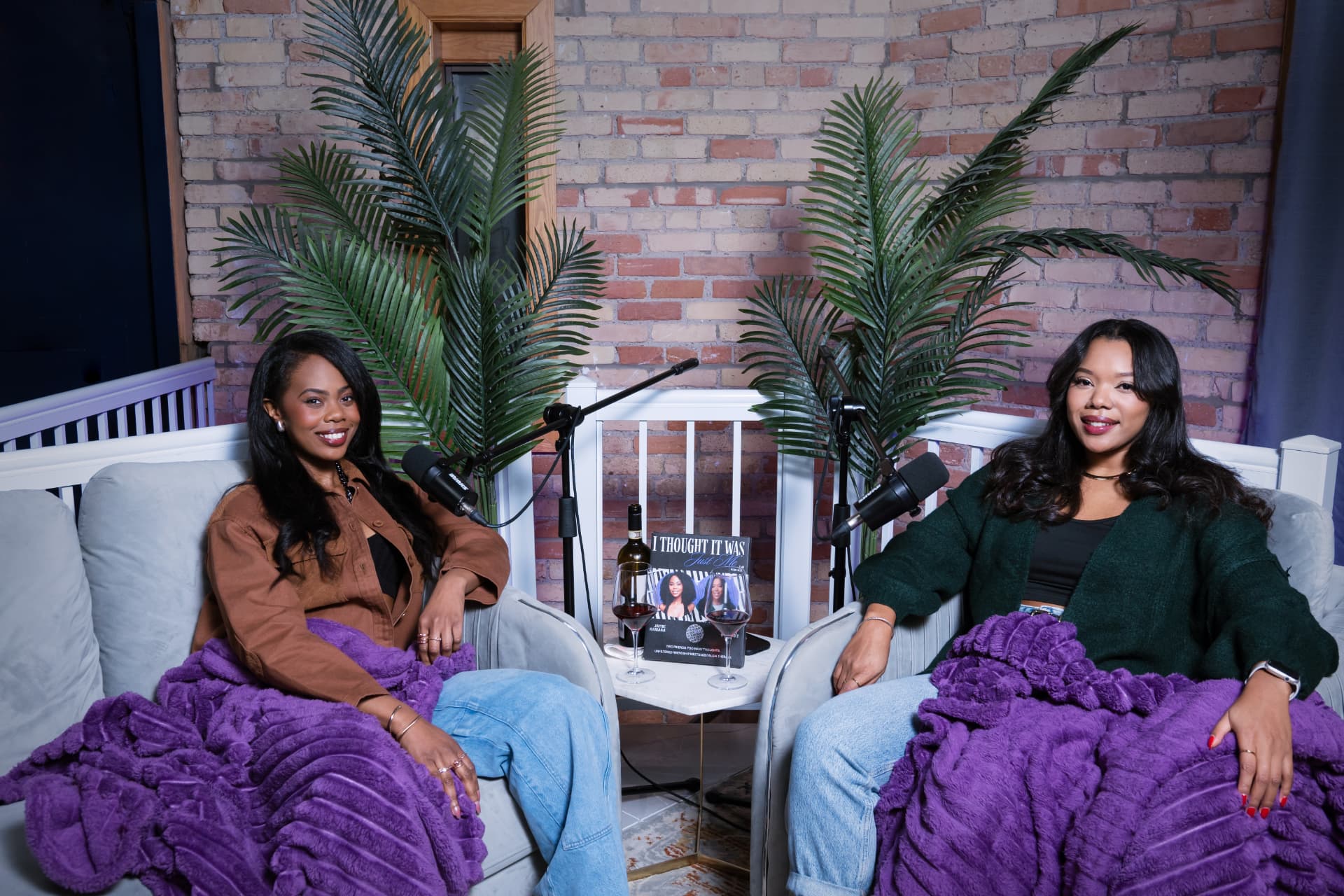 Jayne Kamara and Shawna Stewart on set with mics and purple blankets